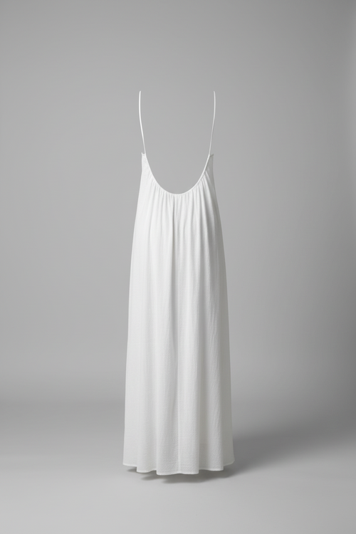White slip dress on a gray background