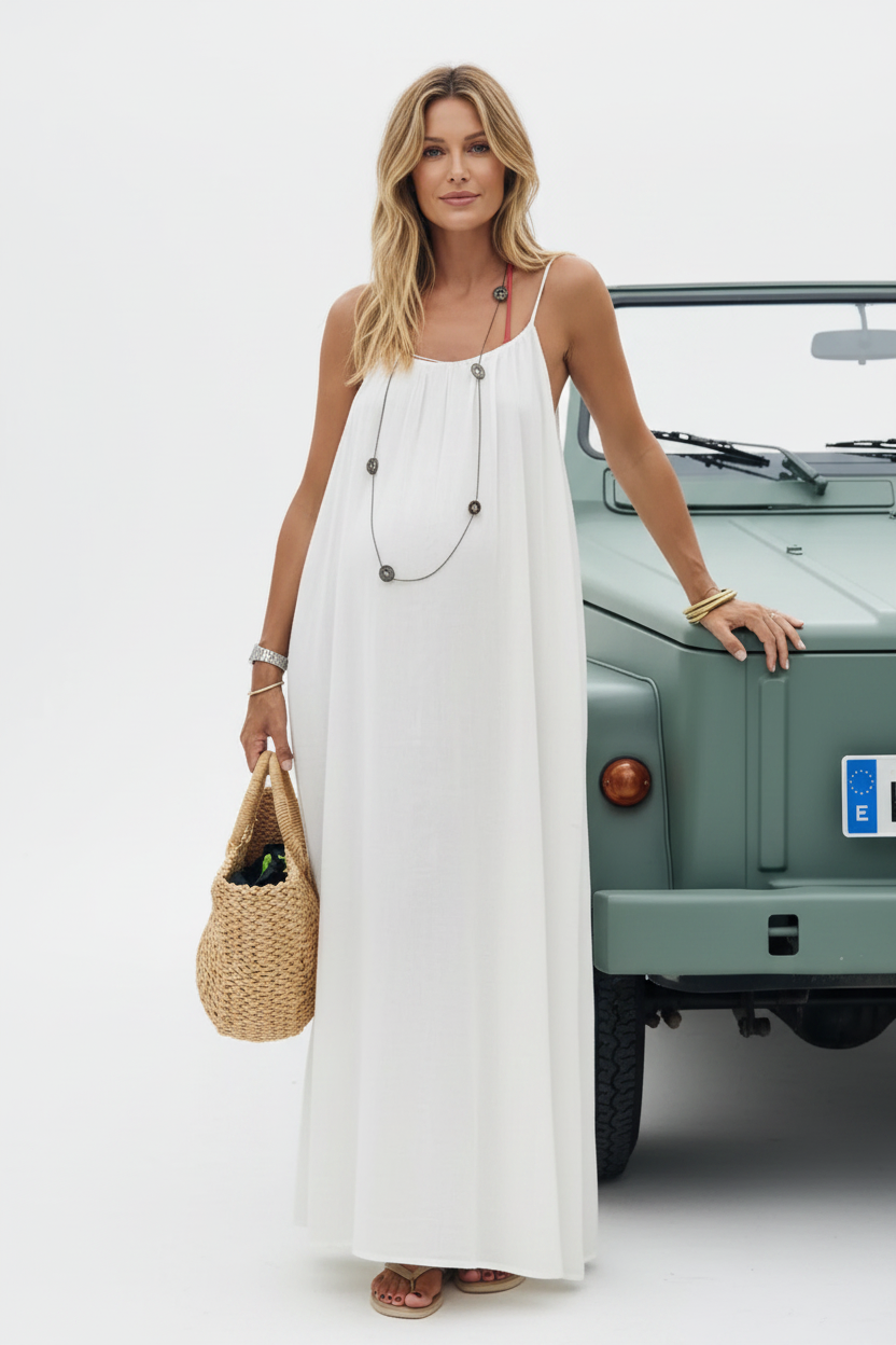 Blonde pregnant model in studio with car